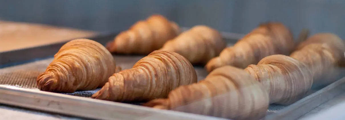 Croissants on a baking tray
