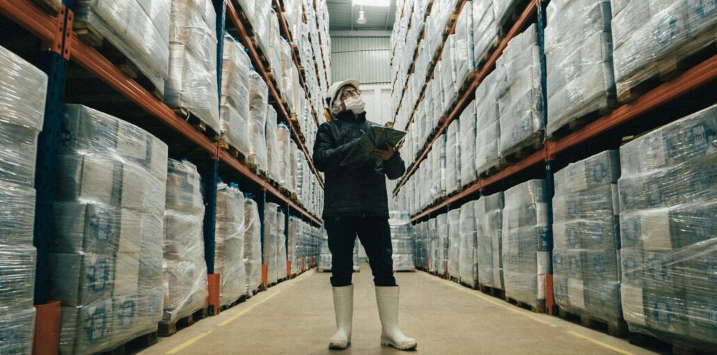 A worker in a factory cold store of frozen food